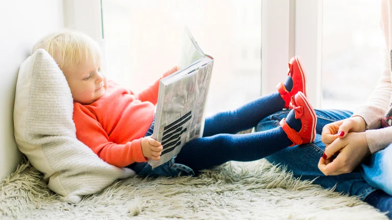 little kid reading a book